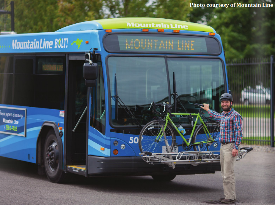 person loading bicycle onto a Mountain Line bus